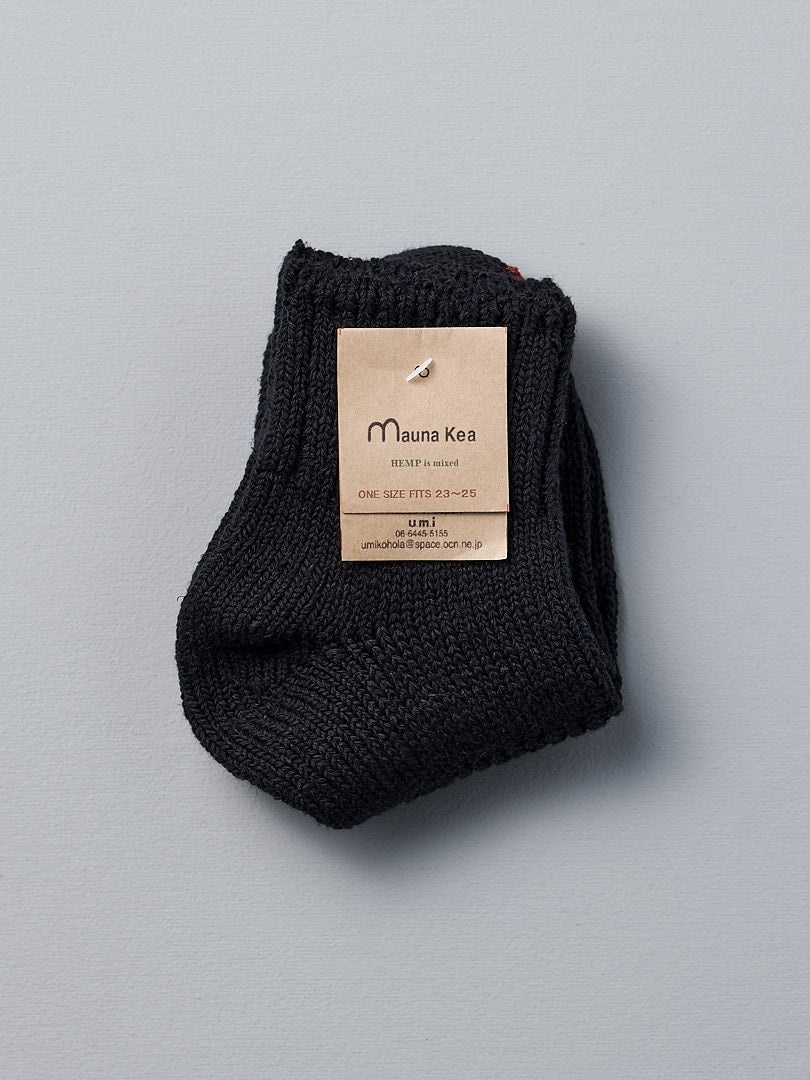 A vintage Mauna Kea black sock with a label, made using soft Japanese Slub on traditional knitting machines in Japan.