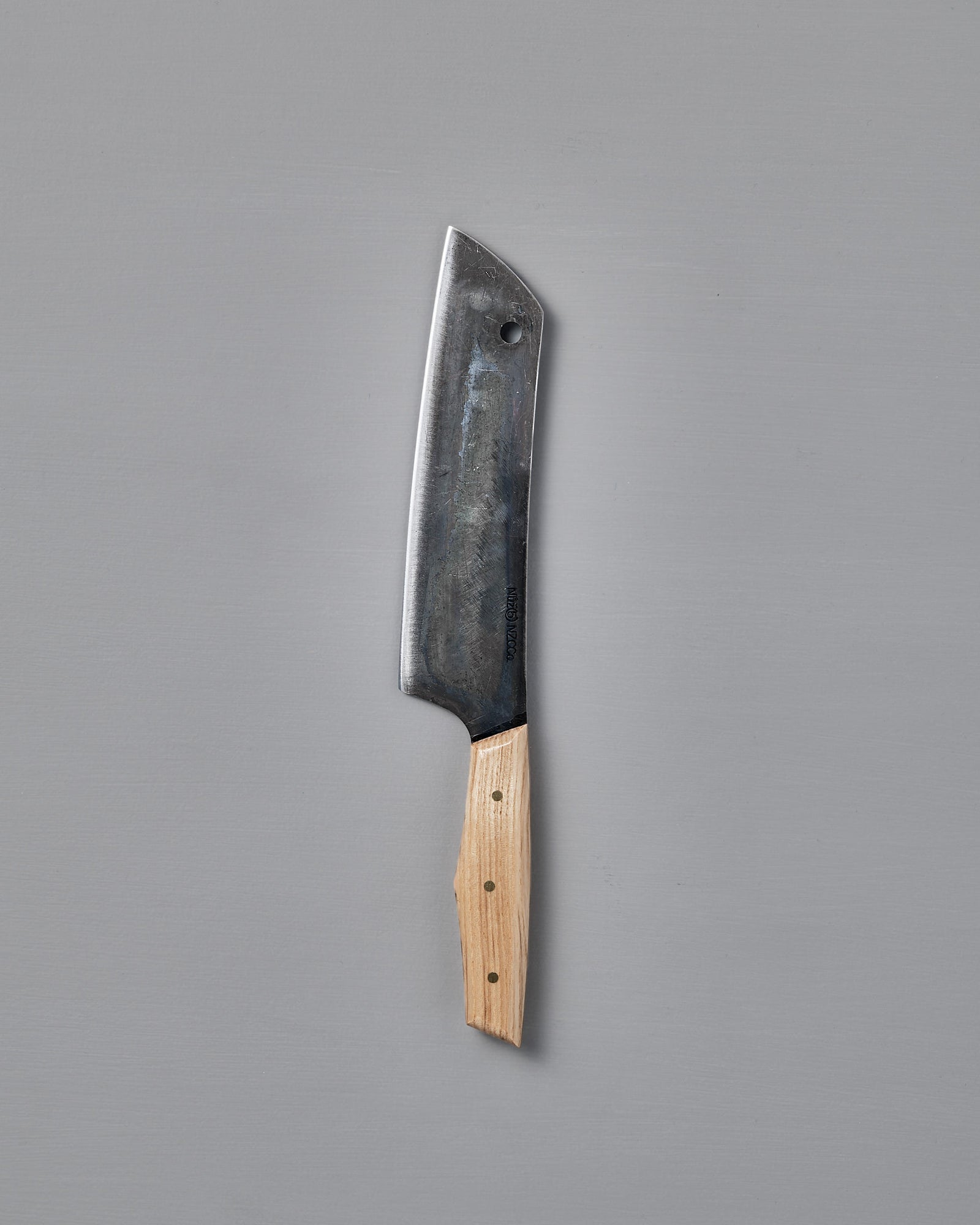 The №5 – Gourmet Knife, a large handcrafted kitchen knife with a dark Swedish carbon steel blade and a light wooden handle, is displayed on a plain grey background.