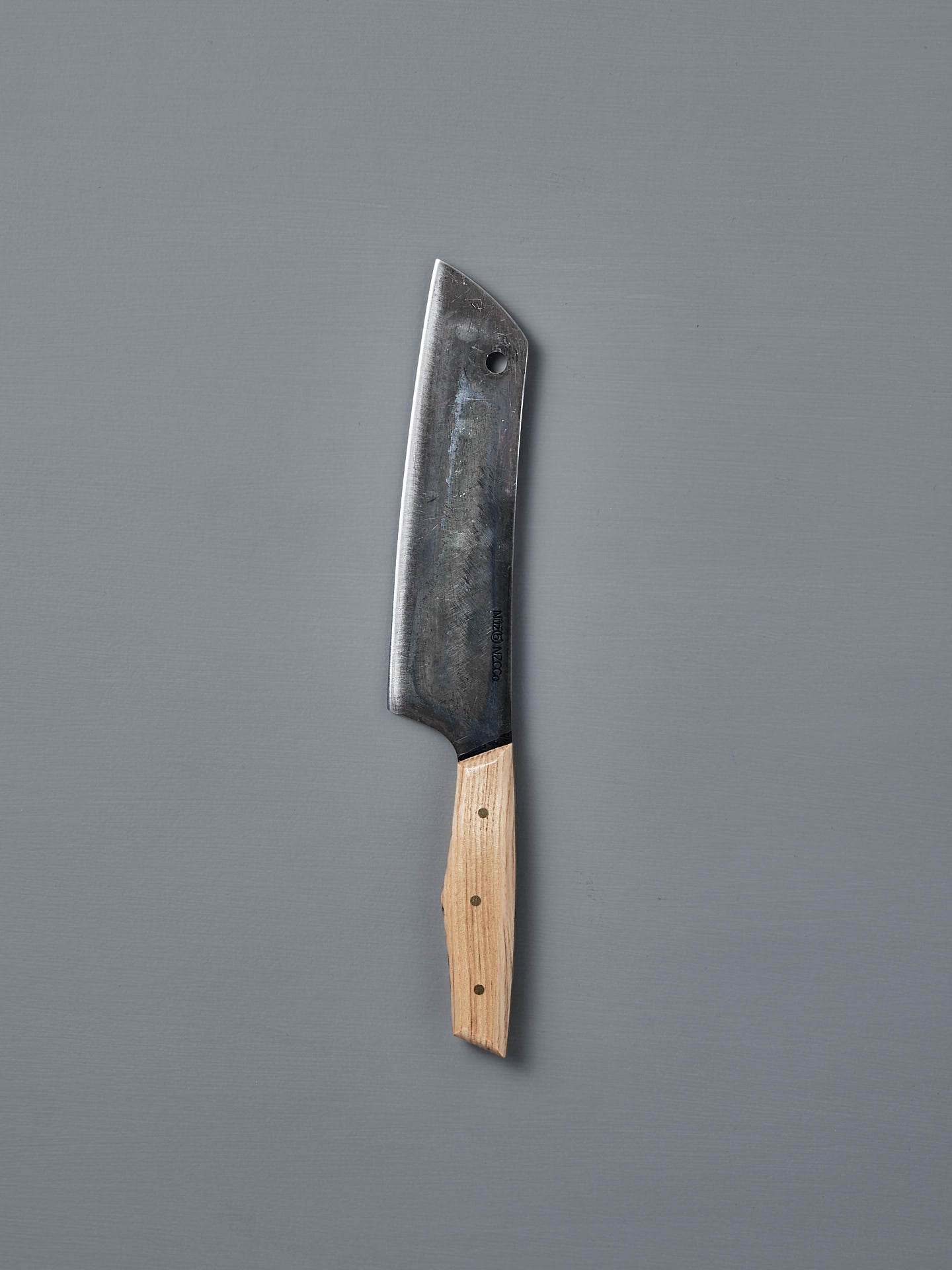 The №5 – Gourmet Knife, a large handcrafted kitchen knife with a dark Swedish carbon steel blade and a light wooden handle, is displayed on a plain grey background.