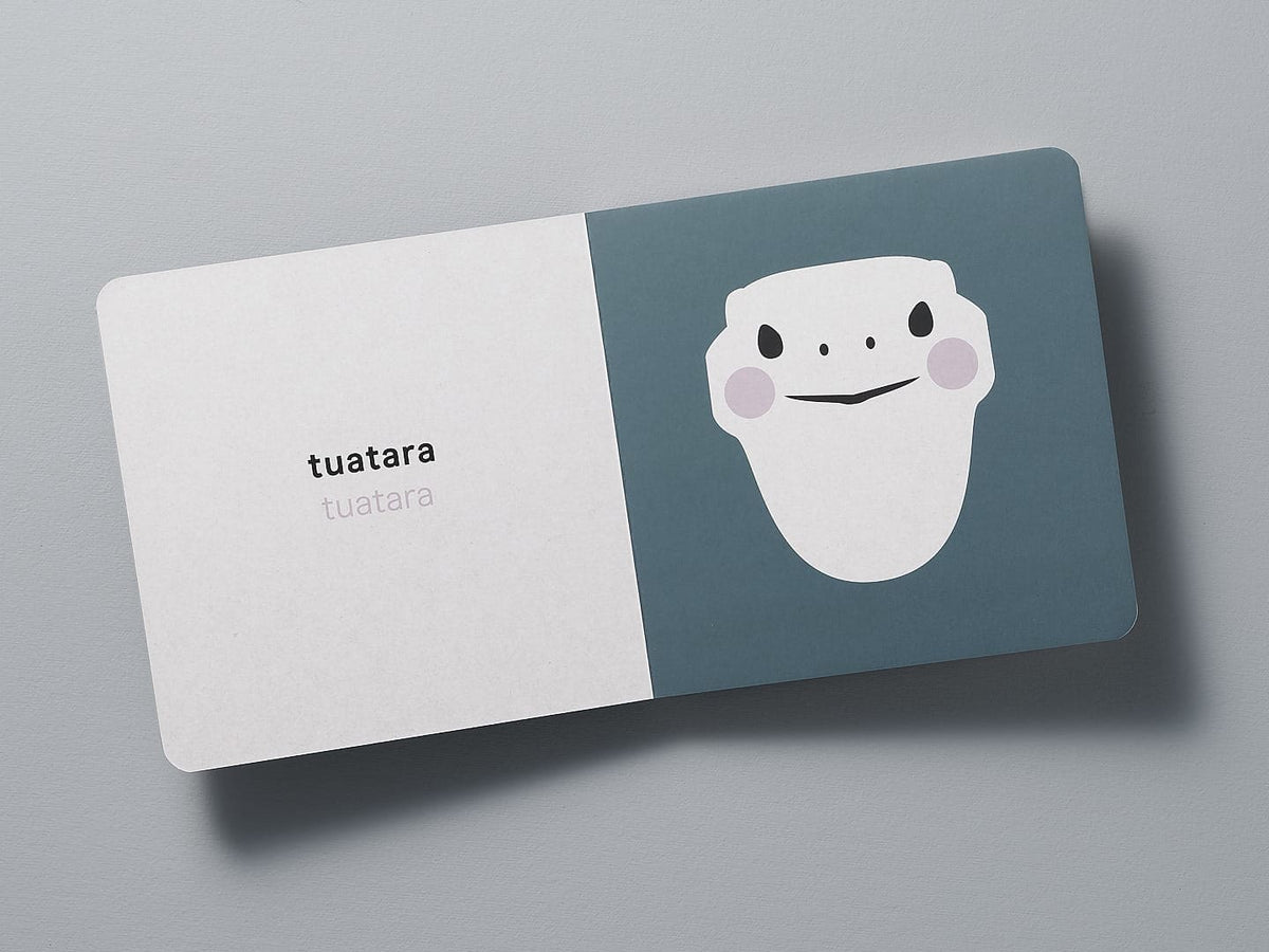 A business card with a minimalist Native NZ Baby Meets Wildlife - by Kate Muir design on a grey background.