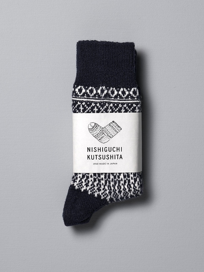 A pair of Oslo Wool Jacquard Socks – Navy from Nishiguchi Kutsushita with an incredible warmth and jacquard design on pre-shrunk wool.