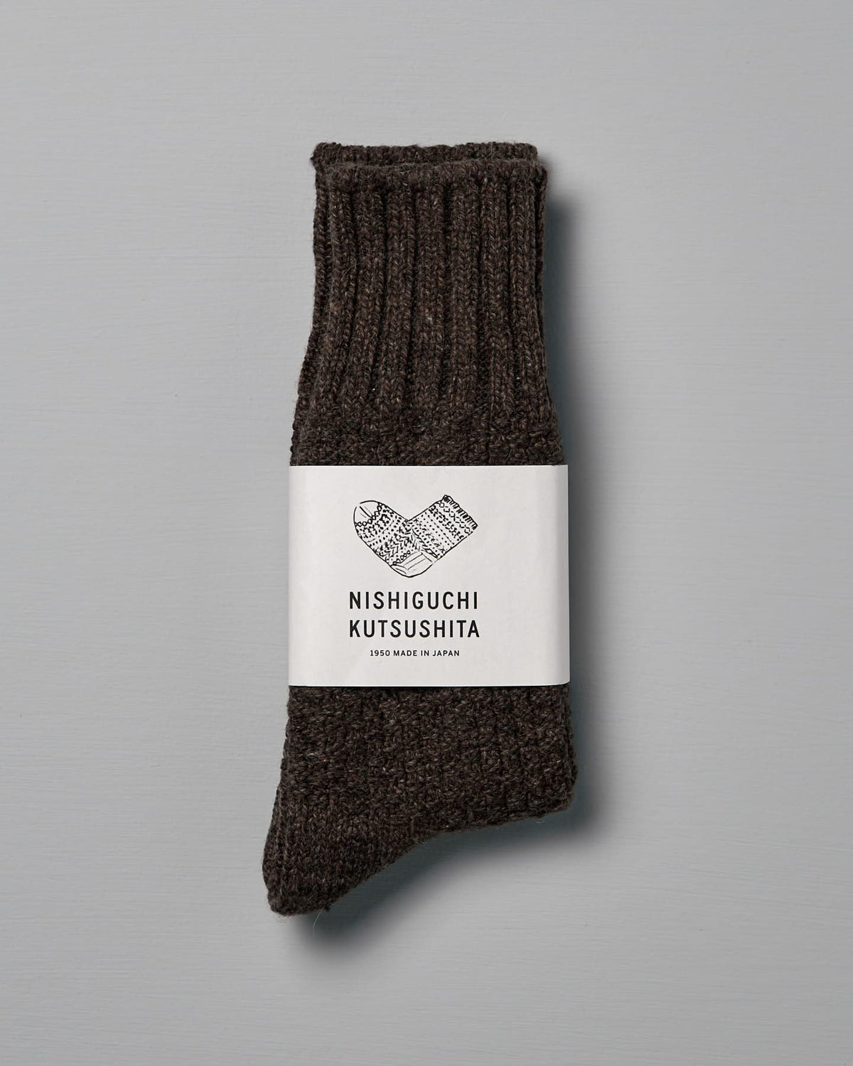 A pair of Wool Cotton Boot Socks – Brown labeled "Nishiguchi Kutsushita," designed to fit US Men's sizes, placed against a plain gray background.