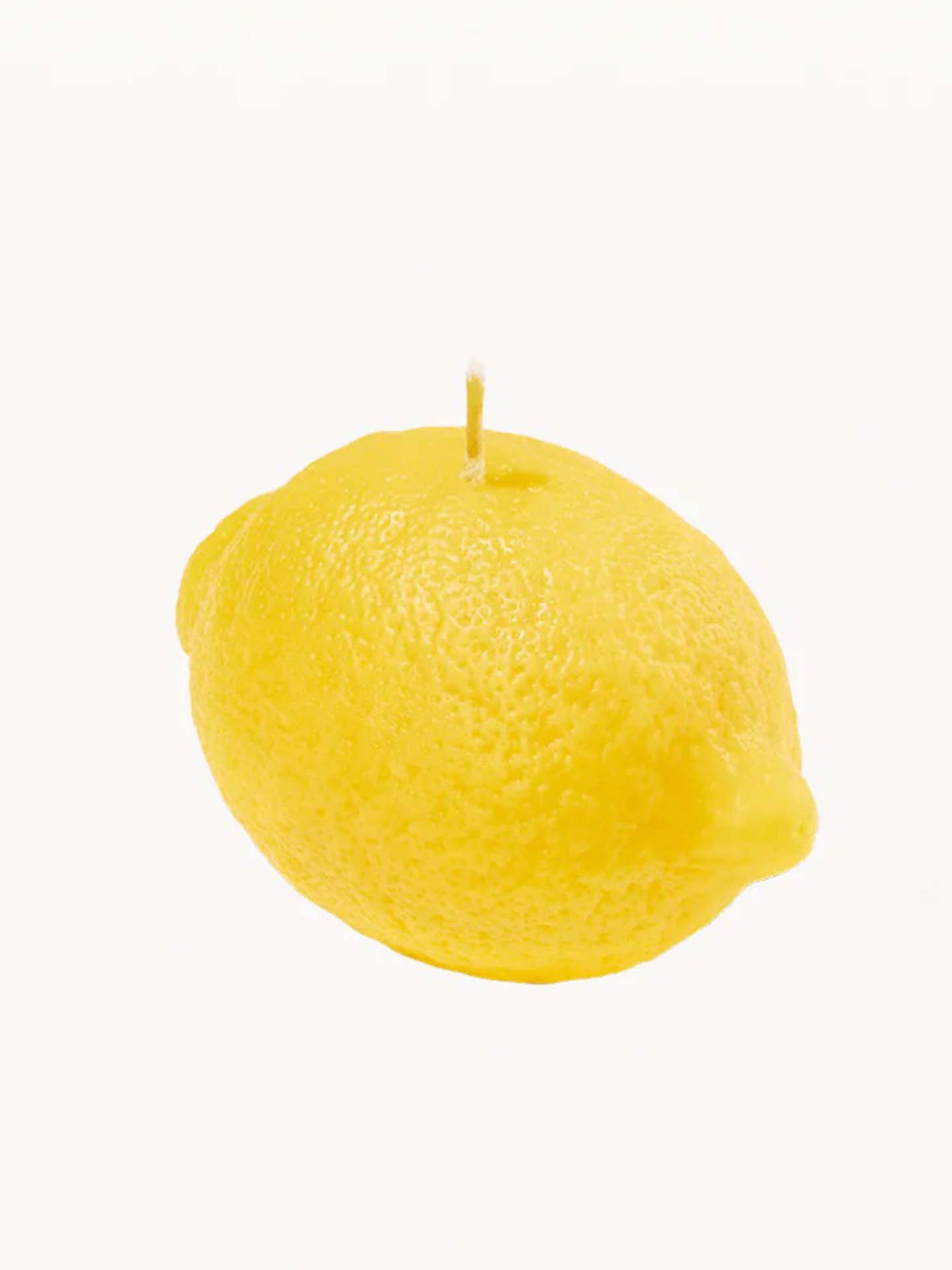 A Scented Lemon Candle from Nonna&#39;s Grocer, crafted from a natural soy wax blend, sits with its wick ready against a plain white background.