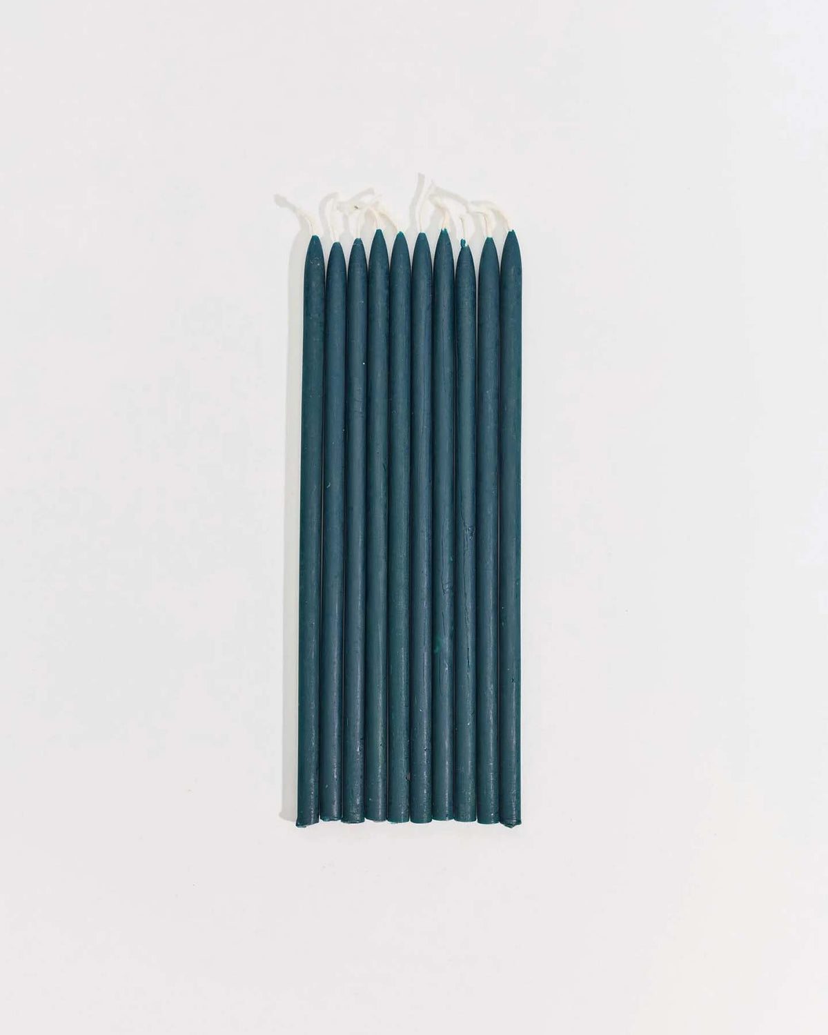 Ten unlit Tall Celebration Candles – Mix & Match are arranged in a straight row on a plain white background.
