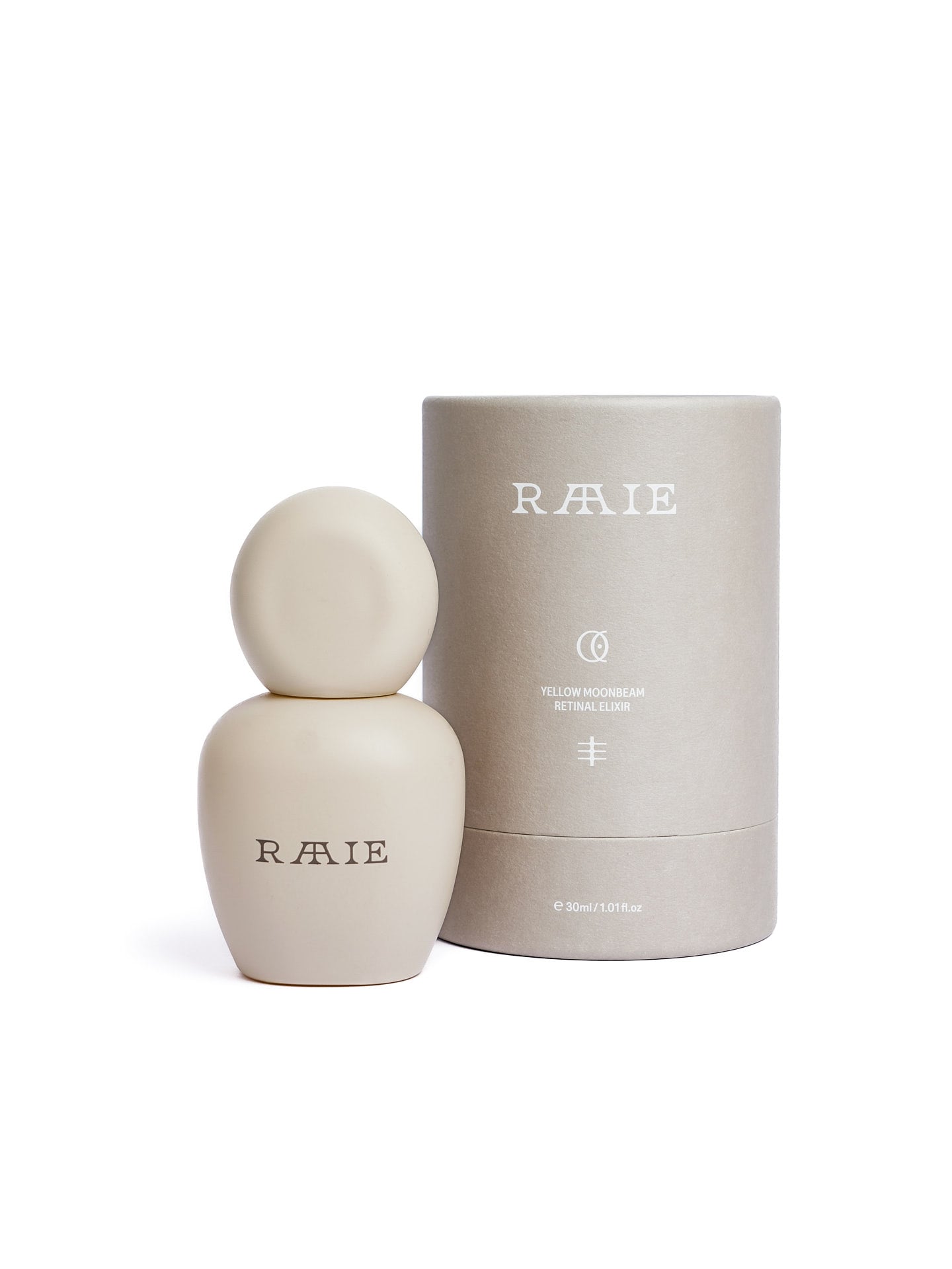 A beige bottle labeled "RAAIE" sits beside a cylindrical container in matching hues. The label on the container reads "Yellow Moonbeam Retinal Elixir" and holds a capacity of 50ml / 1.01 fl oz.