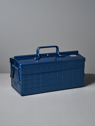 The TOYO STEEL Cantilever Toolbox ST-350 – Blue, featuring powder-coated steel and a checkered pattern, is placed on a white surface against a gray background.