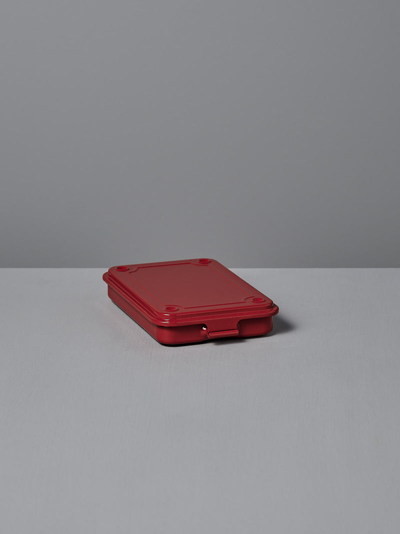 The Mini Steel Toolbox T-152 by TOYO STEEL offers a versatile storage solution, strikingly standing out with its red color against any white surface.