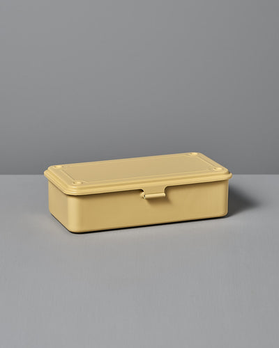 A rectangular Mini Steel Toolbox T-190 in Italian Yellow from TOYO STEEL, crafted from powder-coated steel, rests on a flat surface against a gray background, showcasing its versatile design and durability.