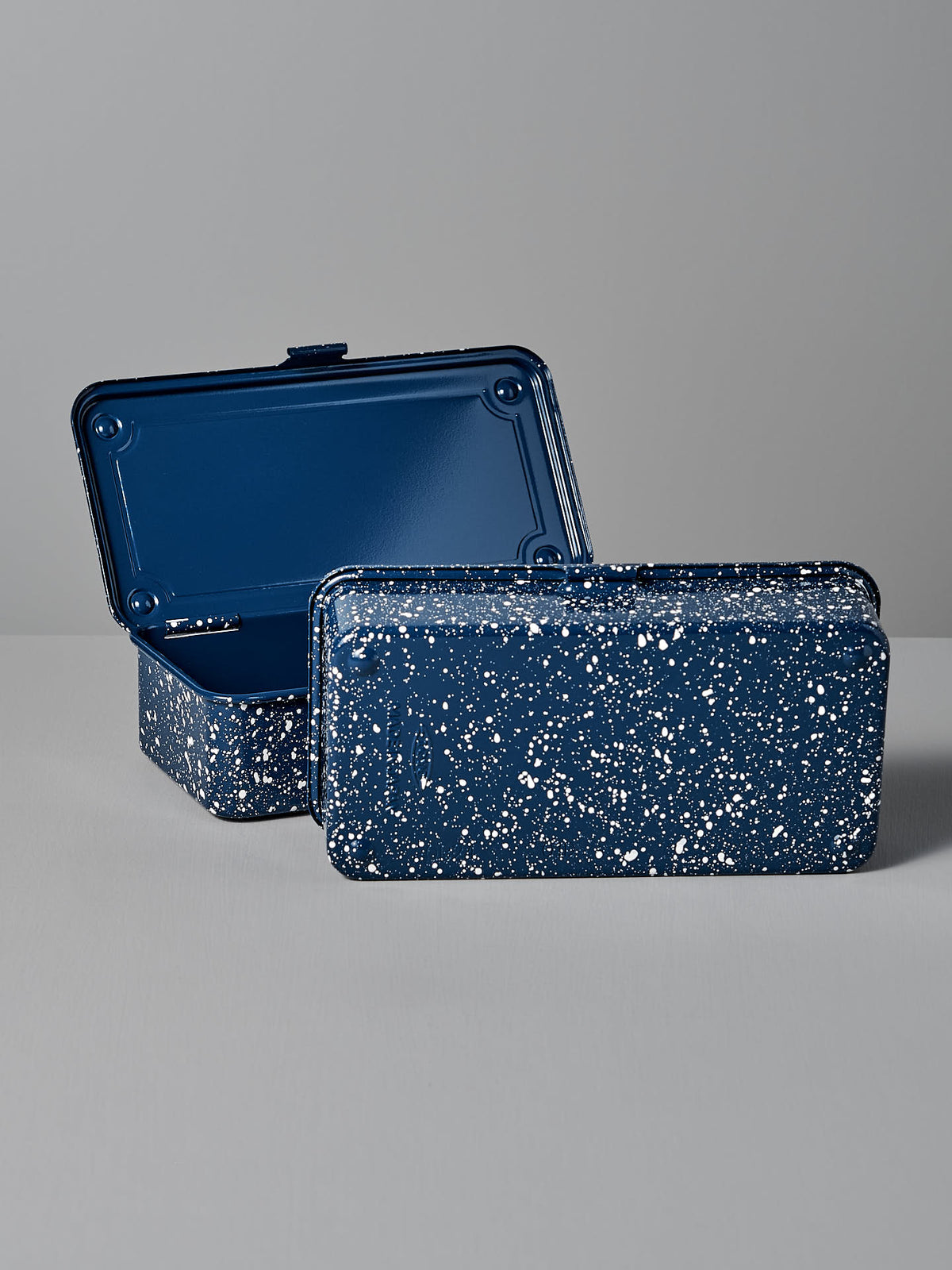 Two Mini Steel Toolboxes T-190 in Japanese Indigo from TOYO STEEL, one open and one closed, showcasing a versatile design on a gray surface.