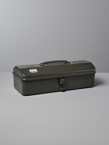 A closed, rectangular, dark green metal Camber-Top Toolbox Y-350 – Moss Green made by TOYO STEEL in Japan with a handle and a latch, sits on a light grey surface.