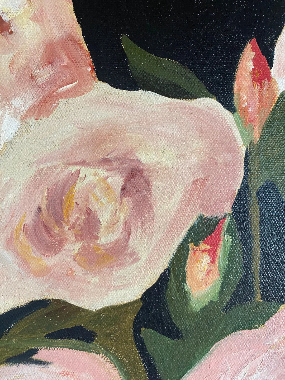 A close-up of a painting featuring light pink roses and green leaves against a dark background, reminiscent of the delicate, timeless floral design found on a Walker &amp; Bing Edith Wool Scarf.