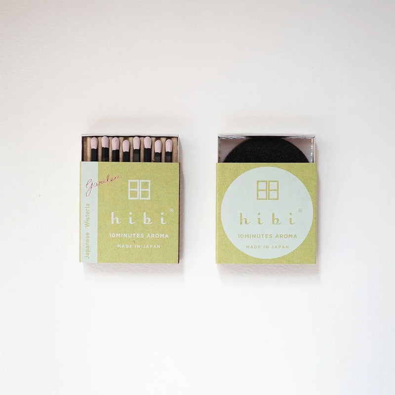 Two hibi Match Box Incense Garden – Japanese Wisteria on a white surface.