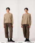 Side-by-side comparison of a woman wearing the Nimbus Raglan Knit – Truffle sweater, labeled “PETITE FIT” on the left and “RELAXED FIT” on the right, showcasing the difference between a tailored fit and a looser style.