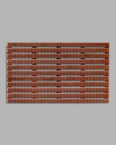 The Iris Hantverk Wooden Doormat with Bristles – Large features a rectangular layout of small, uniform terracotta tiles set against a gray background and includes a raised beechwood base designed to effectively trap sand and dirt.