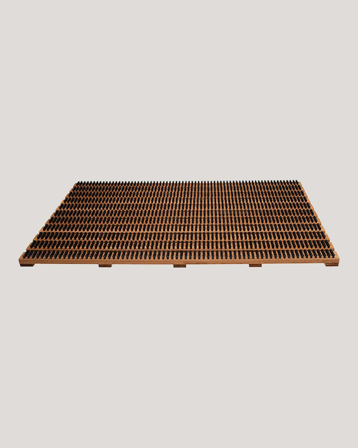 A large rectangular doormat by Iris Hantverk, featuring a durable wooden design with synthetic fiber bristles set against a neutral background.