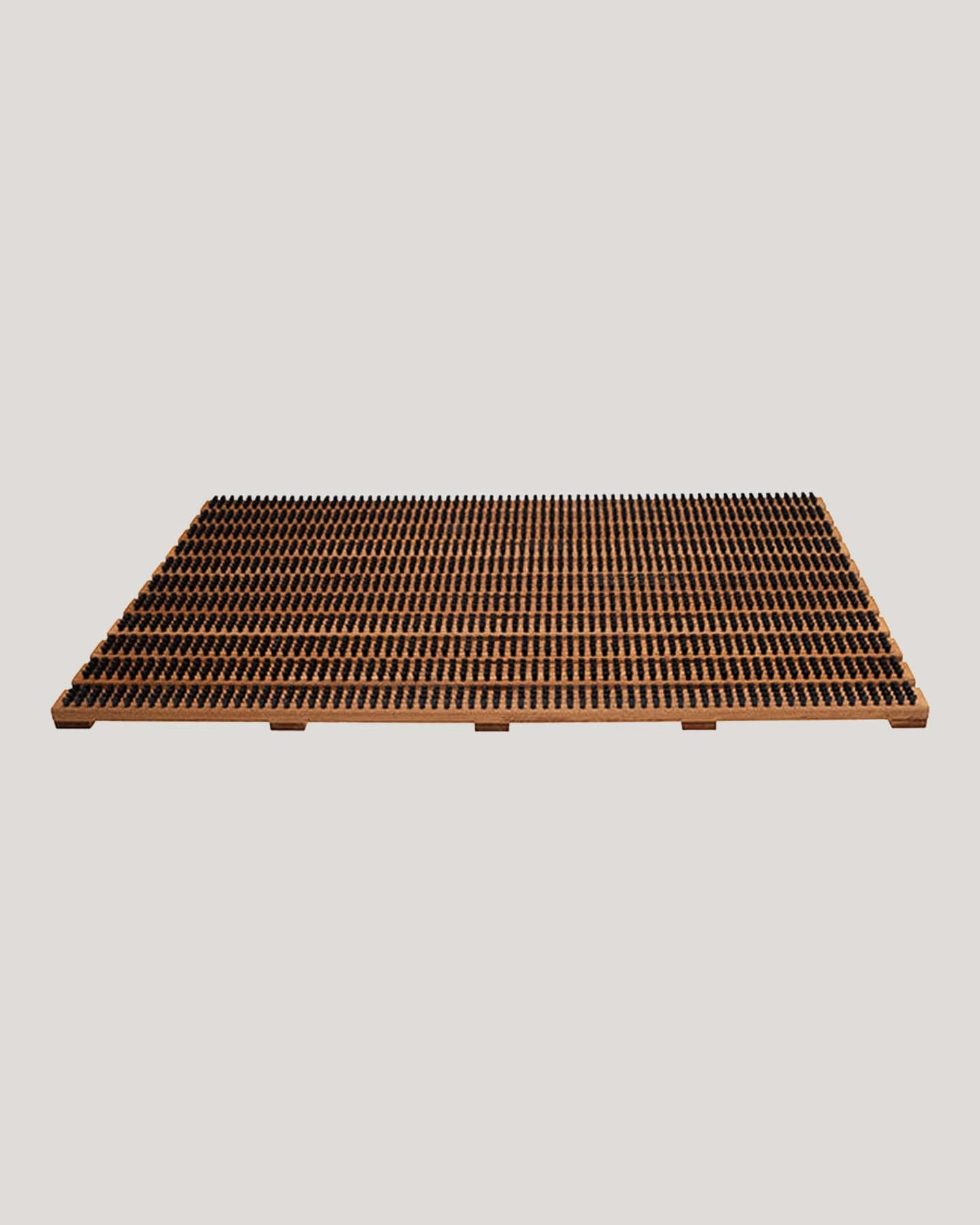 The Iris Hantverk Wooden Doormat with Bristles – Large features a rectangular layout of small, uniform terracotta tiles set against a gray background and includes a raised beechwood base designed to effectively trap sand and dirt.