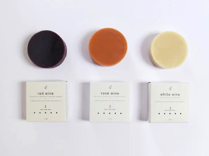 Four different types of Studio Star White Wine Soap on a white surface.
