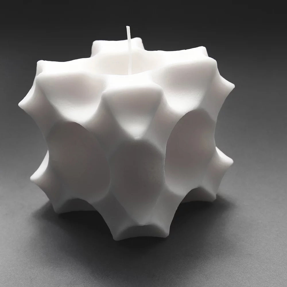 A Crux Candle with white wax inside, made by Andrej Urem.