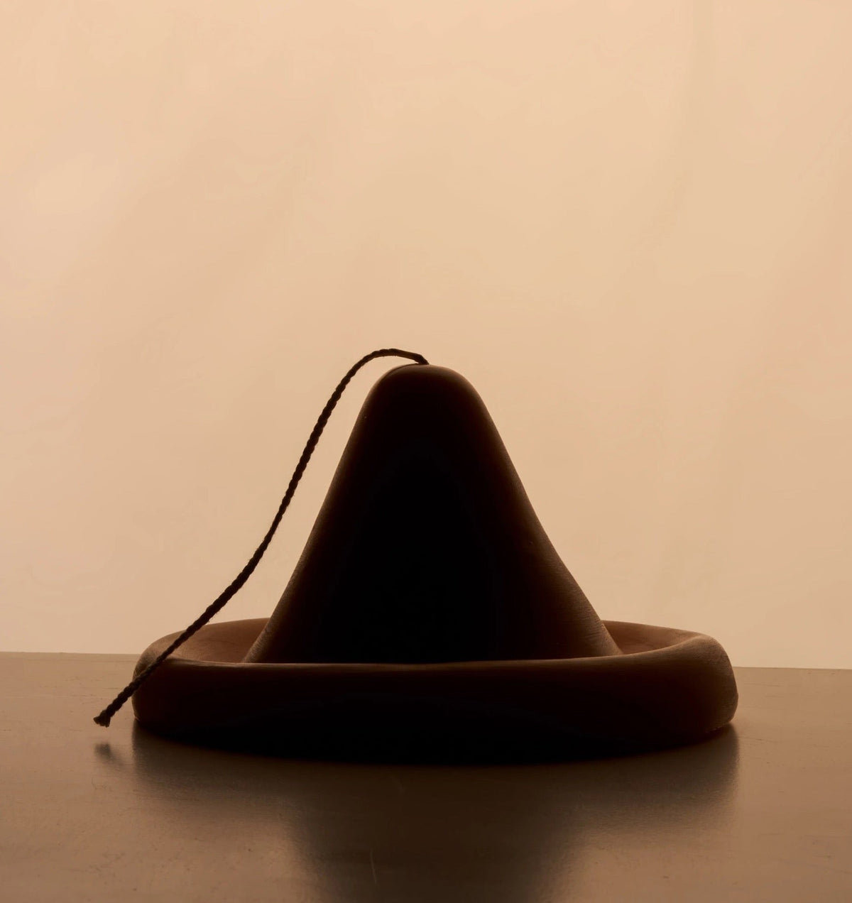 An Onno Candle by ann vincent sitting on top of a table.