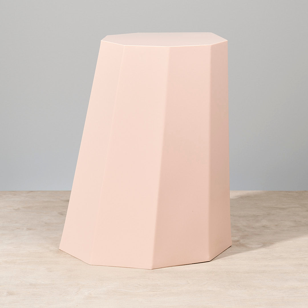 An Arnold Circus Stool – Pink by Martino Gamper on a white surface.