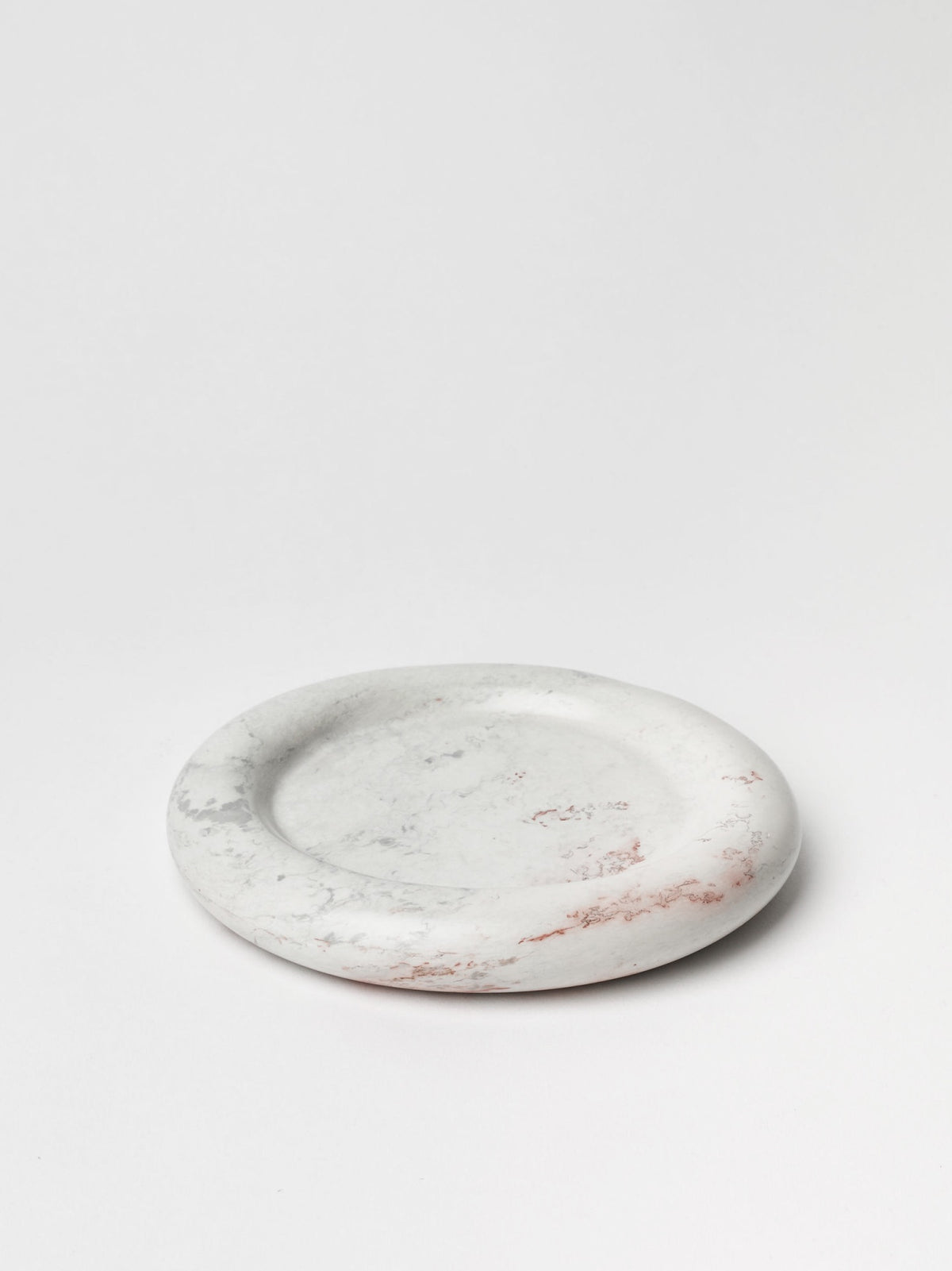 An Asili Stacker Round Tray - Malachite on a white surface.