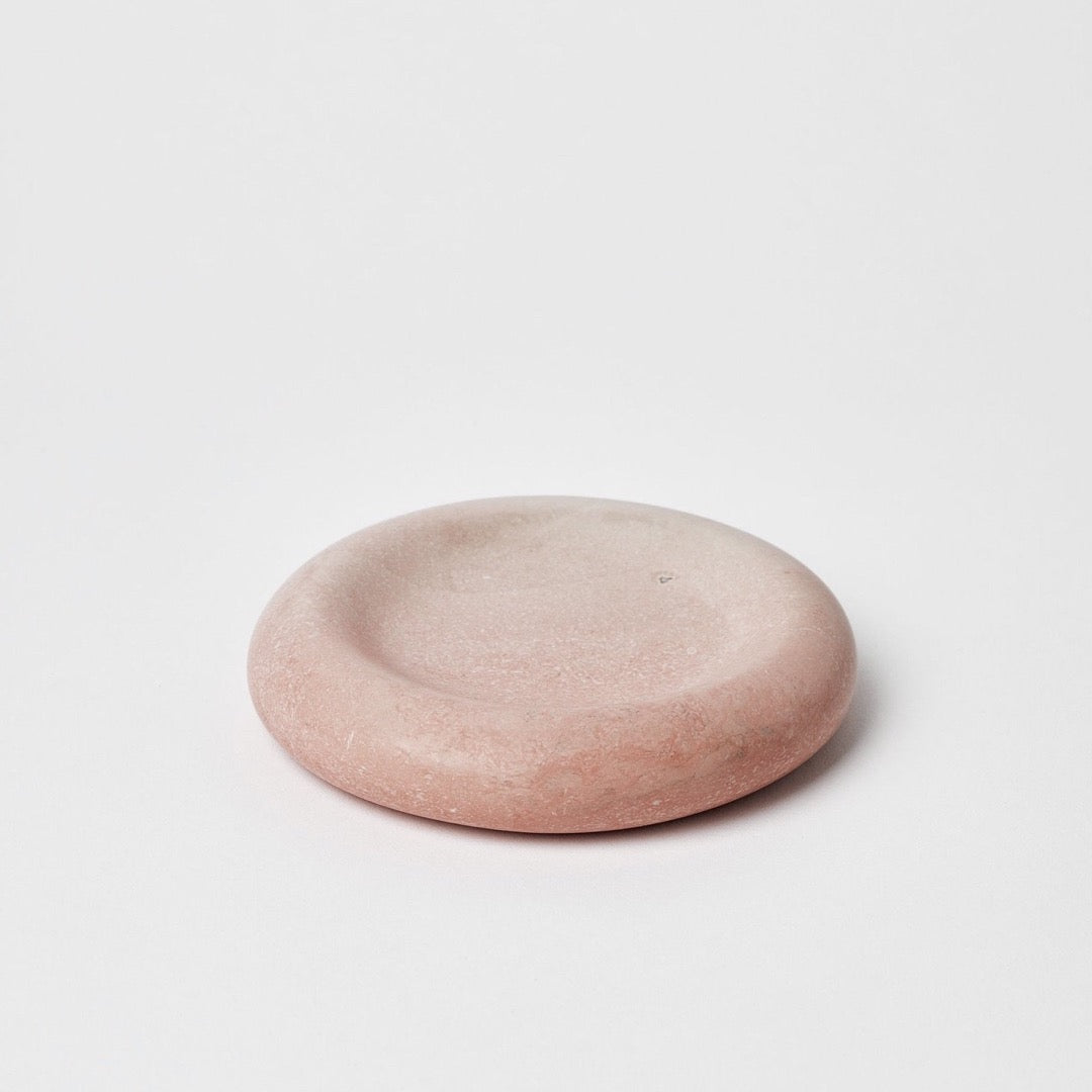 An Asili Stacker Round Tray – Pink on a white surface.