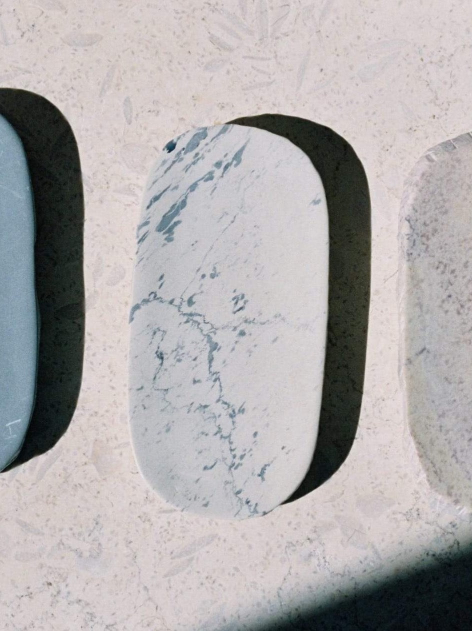Three pieces of Textured Tray – Malachite sitting on top of Asili.