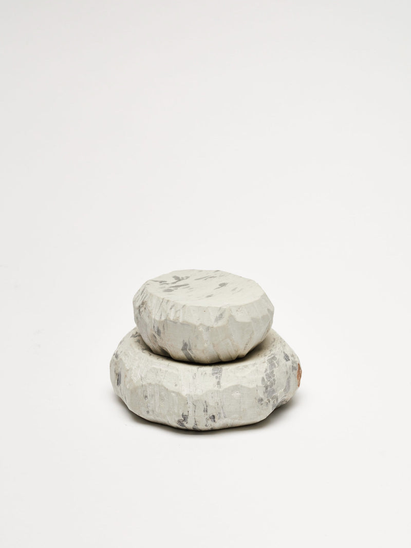 A stack of Textured Dish Sets - Malachite by Asili on a white surface.