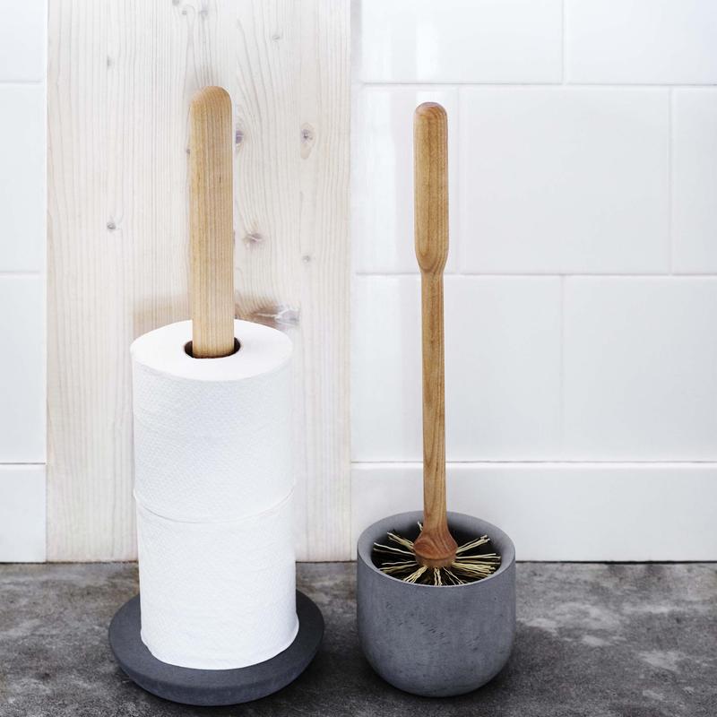 Two Iris Hantverk toilet paper holders next to each other.