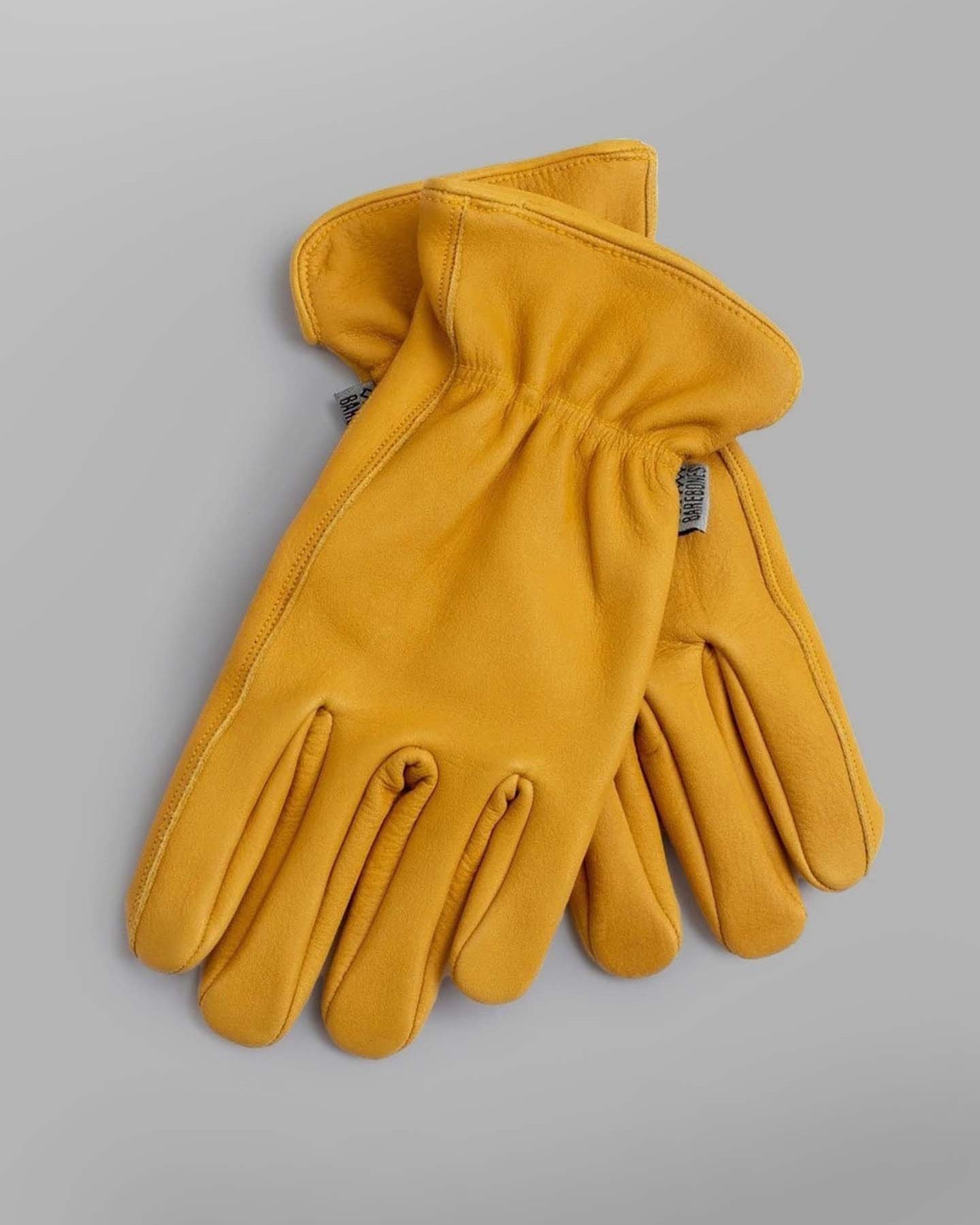 A pair of Barebones Classic Work Gloves – Natural Yellow on a white background.