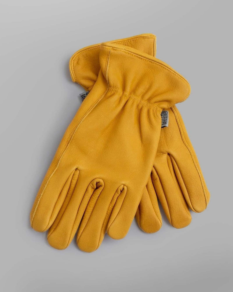 A pair of Barebones Classic Work Gloves – Natural Yellow on a white background.