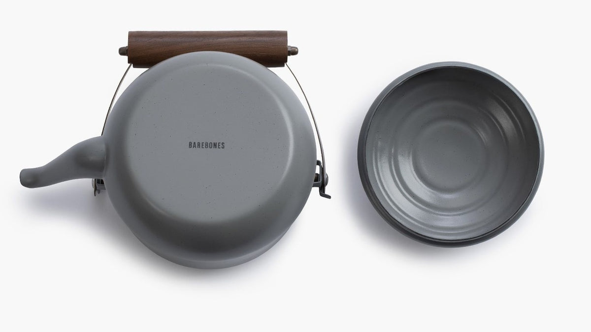 A Enamel Teapot – Slate Grey by Barebones and a bowl on a white surface.