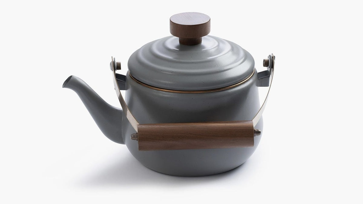 A Enamel Teapot – Slate Grey with a wooden handle by Barebones.