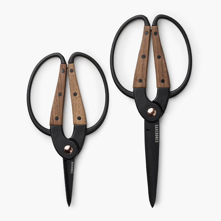 Two pairs of Barebones Walnut Garden Scissors – Large on a white surface.
