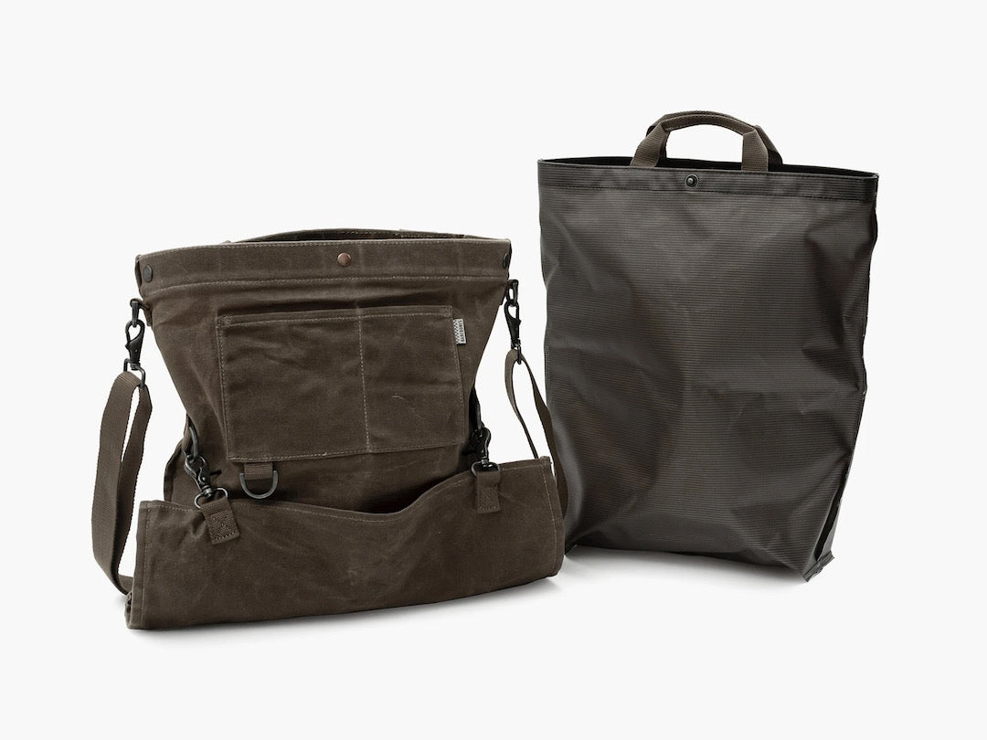 A Gathering Bag - Khaki by Barebones and a black bag next to each other.