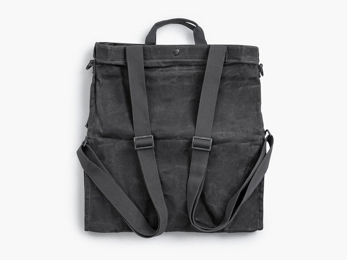A  Gathering Bag – Grey backpack with straps on a white background by Barebones.