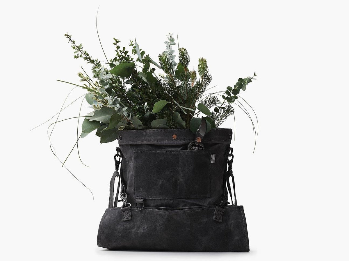 A Gathering Bag – Grey with a bunch of plants in it. (Brand: Barebones)