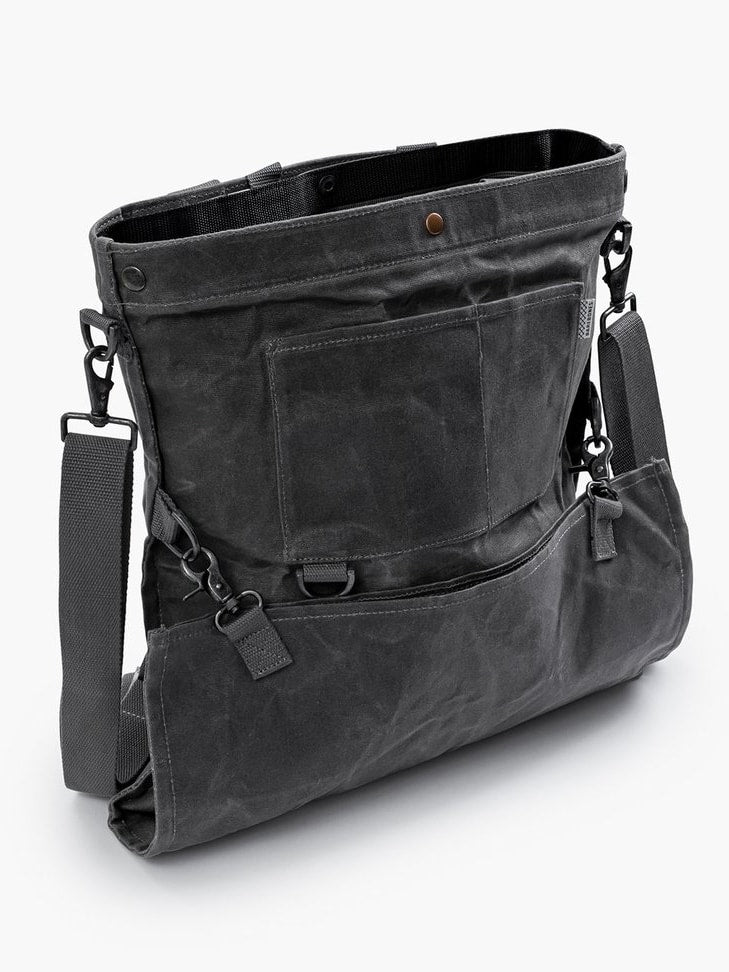A Barebones Gathering Bag - Grey with two straps on it.