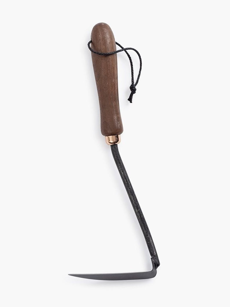 A Japanese Weeding Hoe with a black handle on a white background by Barebones.