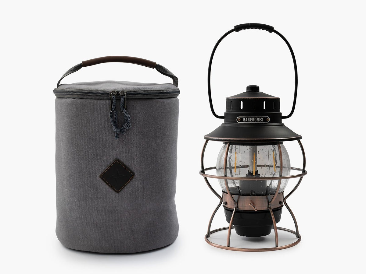 A Barebones Lantern Storage Bag – Waxed Canvas and a bag next to each other.