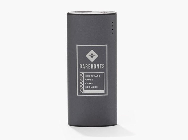 A black Barebones Portable Charger – Integrated Torch with a logo on it.