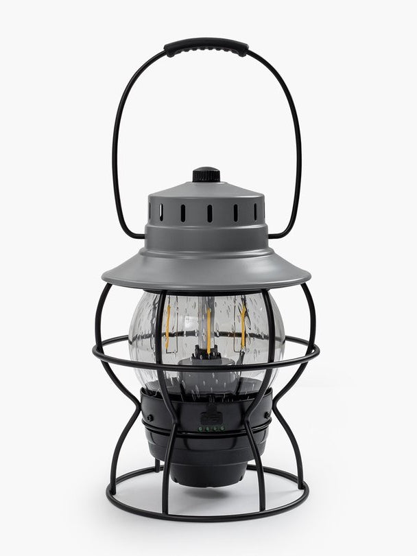 A Barebones Railroad Lantern – Slate Grey with a wire cage on top.