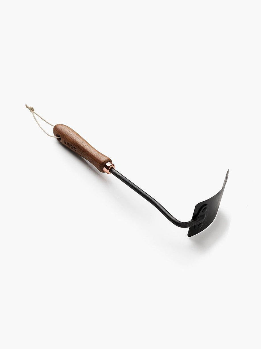 A Square Hand Hoe with a wooden handle by Barebones on a white surface.