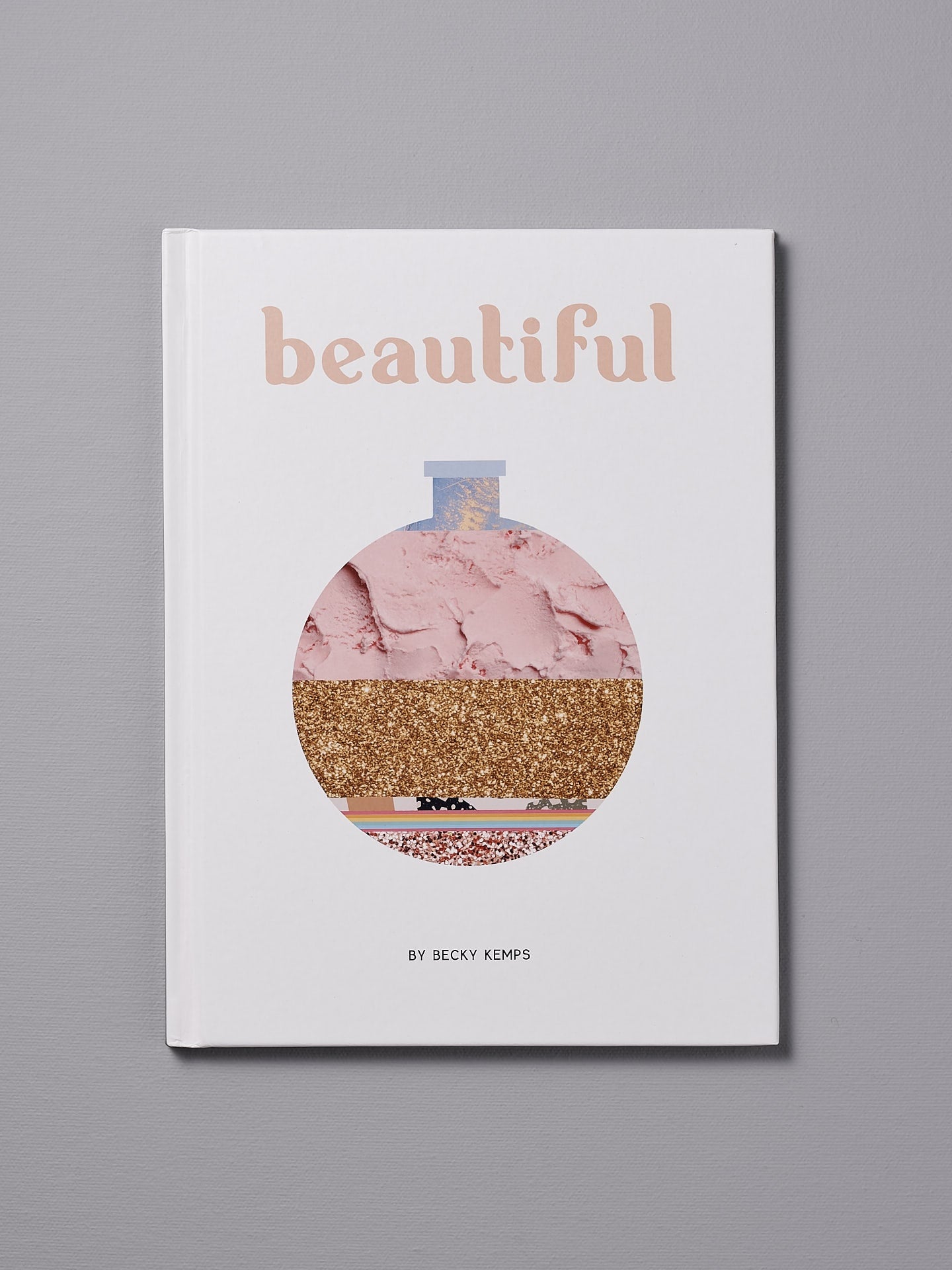 A unique book titled "Beautiful – by Becky Kemps" with a minimalistic cover design featuring abstract layered textures.