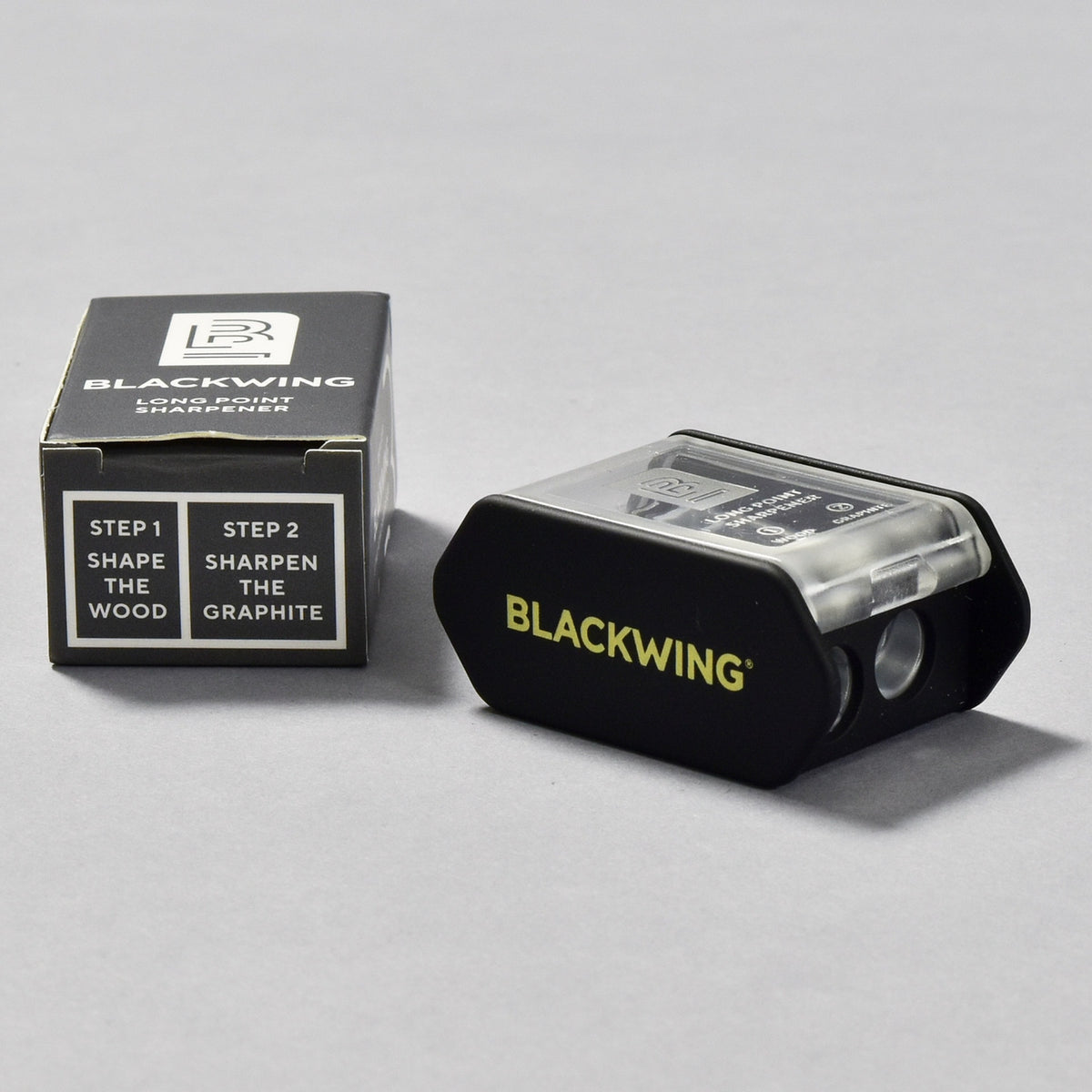 A Palomino Blackwing Long Point Pencil Sharpener with a box next to it.