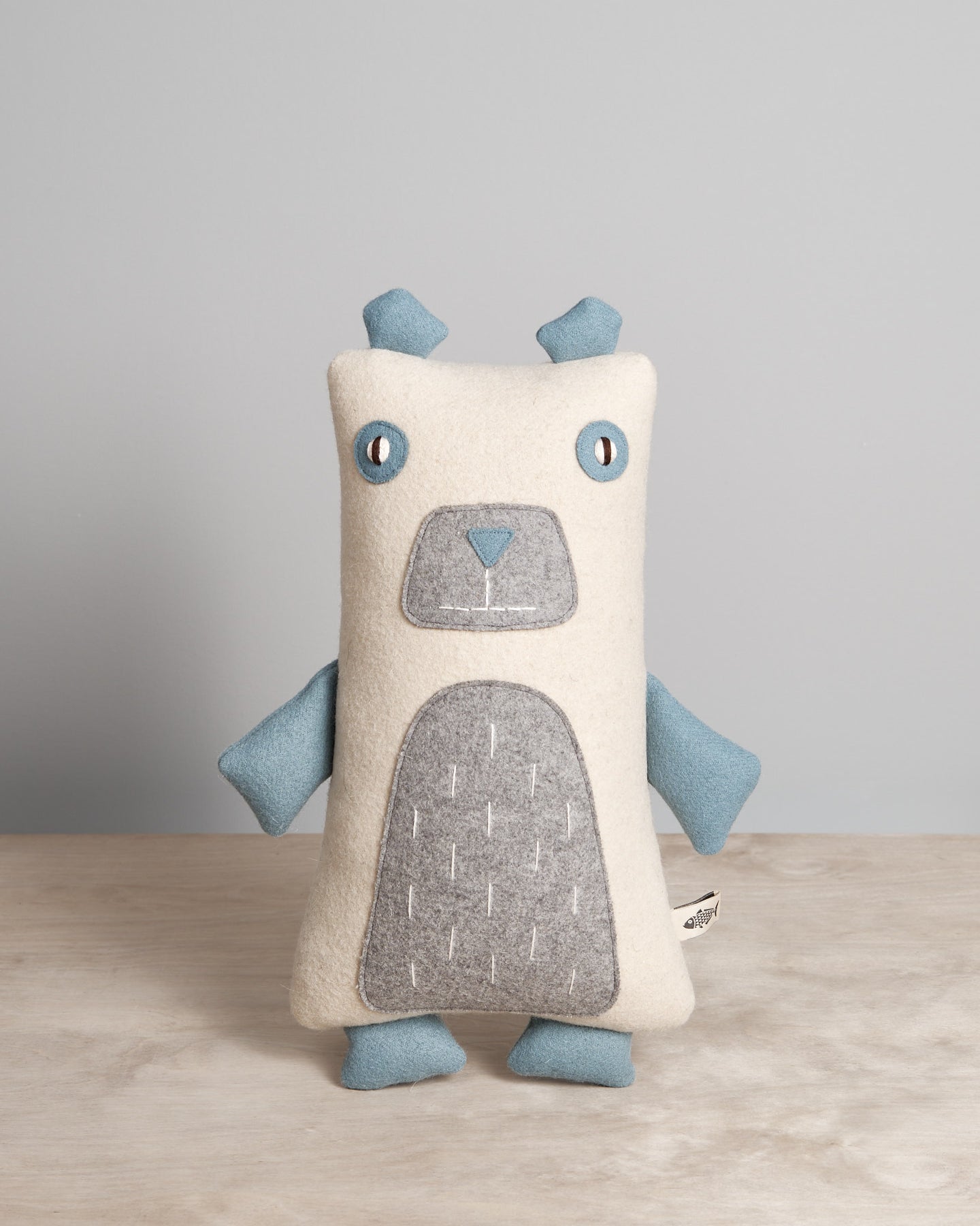 A NASH, the North American Polar Bear stuffed toy on a table.