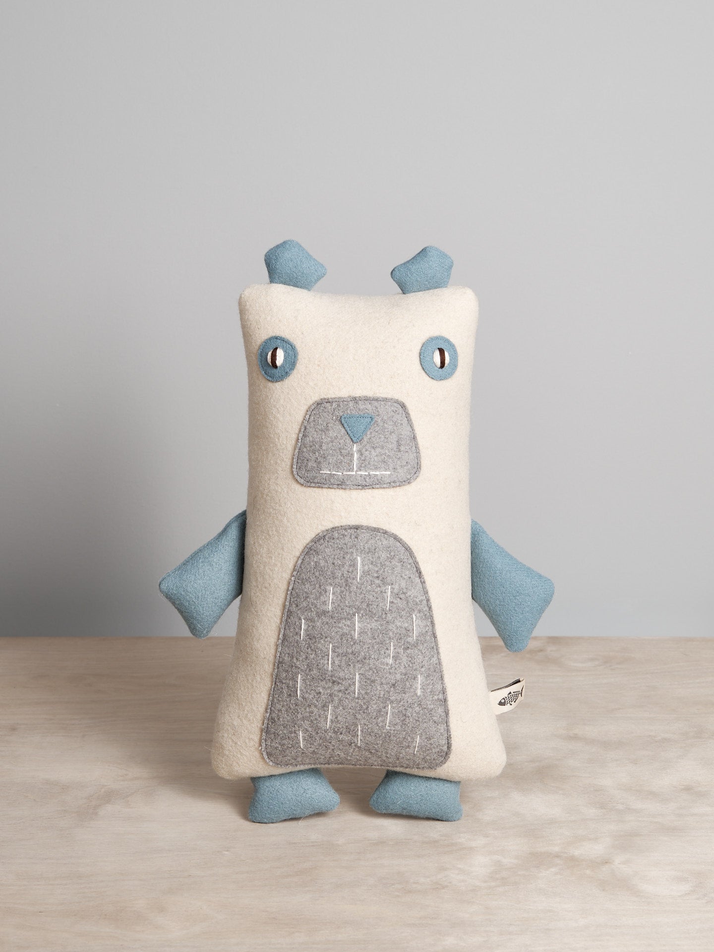 A NASH, the North American Polar Bear stuffed toy on a table.