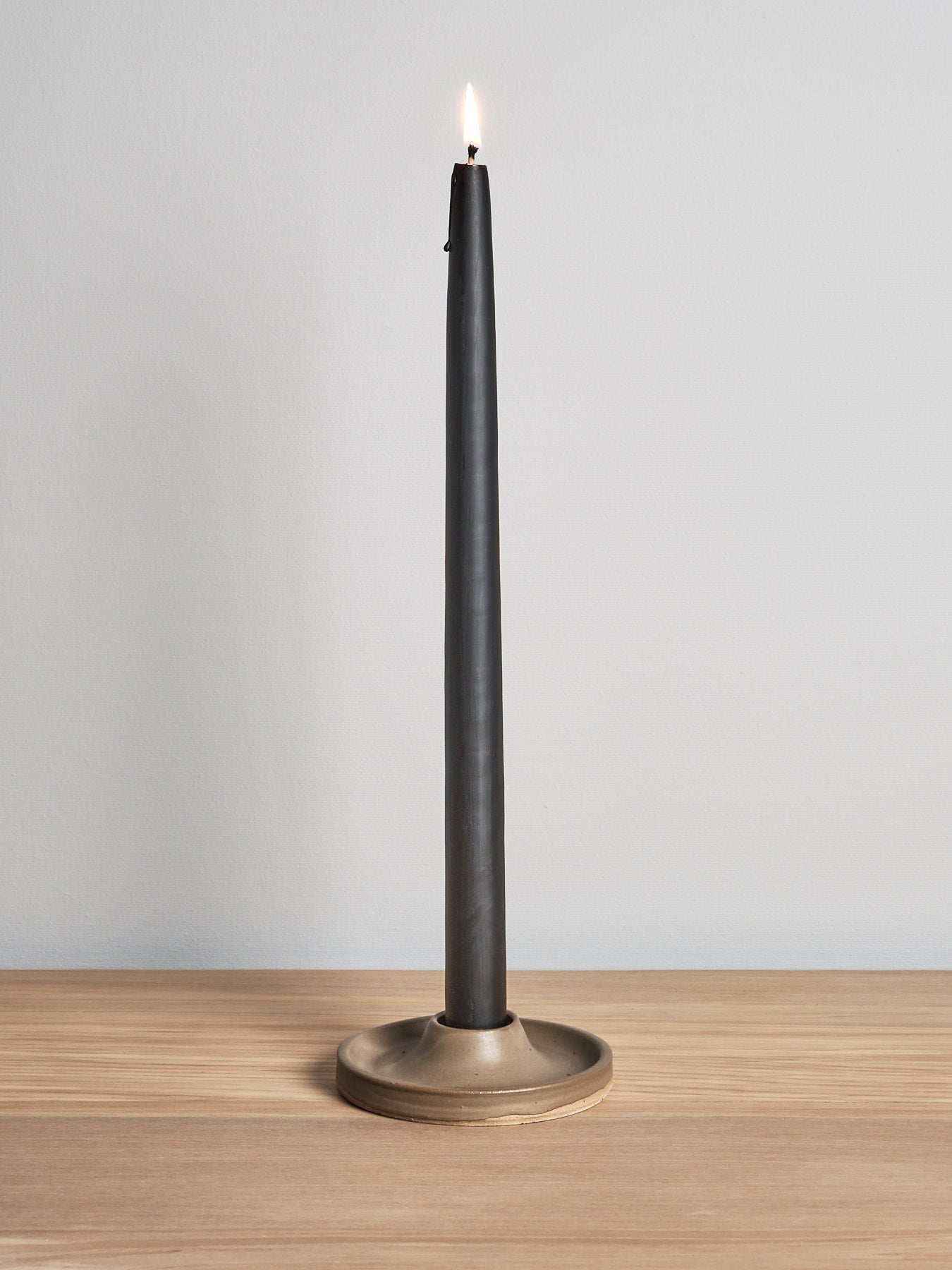 A Candle Holder – Moss by deborah sweeney on a wooden table.