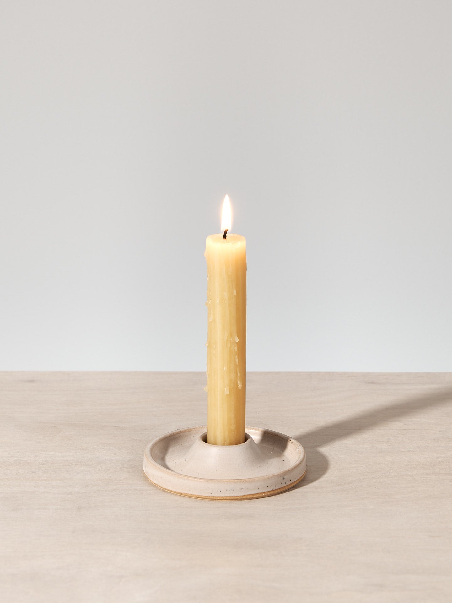 A Candle Holder - Cloud by deborah sweeney is sitting on top of a wooden table.