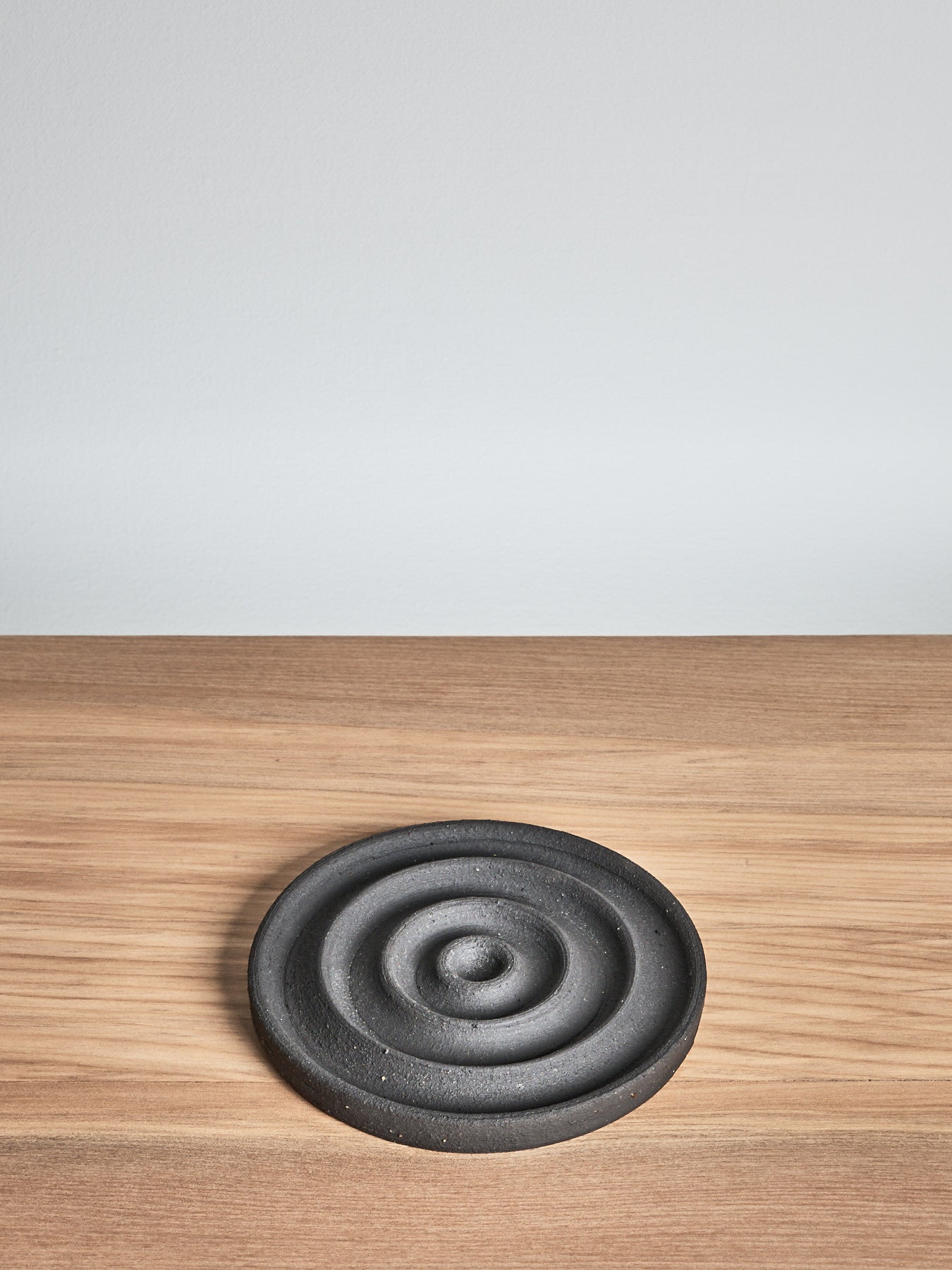 A Soap Dish – Black by deborah sweeney on a wooden table.